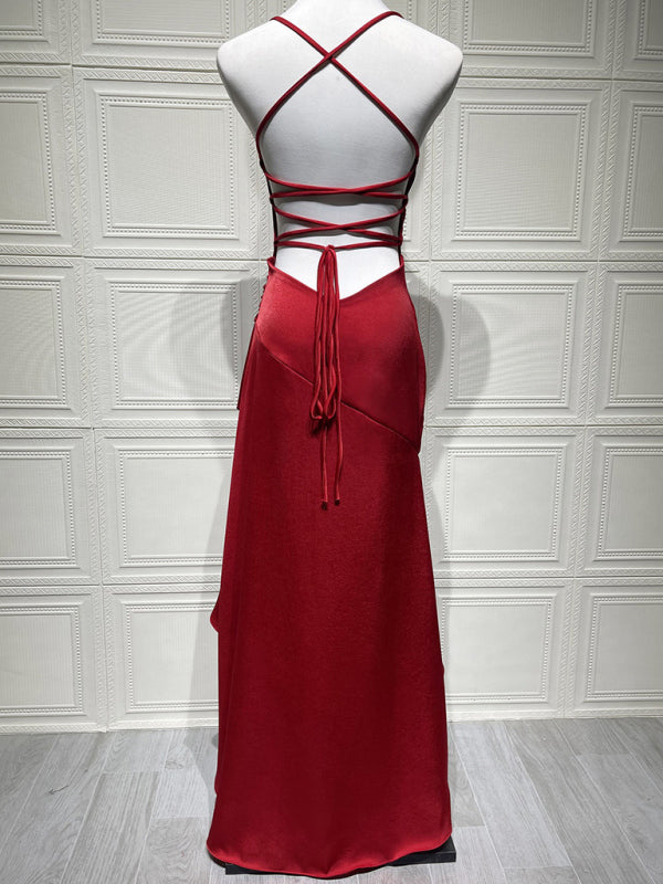 Sexy halter dress with ruffled, irregular hem.